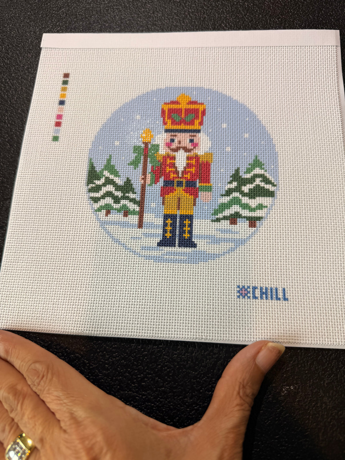 Close-up of the red and gold nutcracker on 18 mesh needlepoint canvas