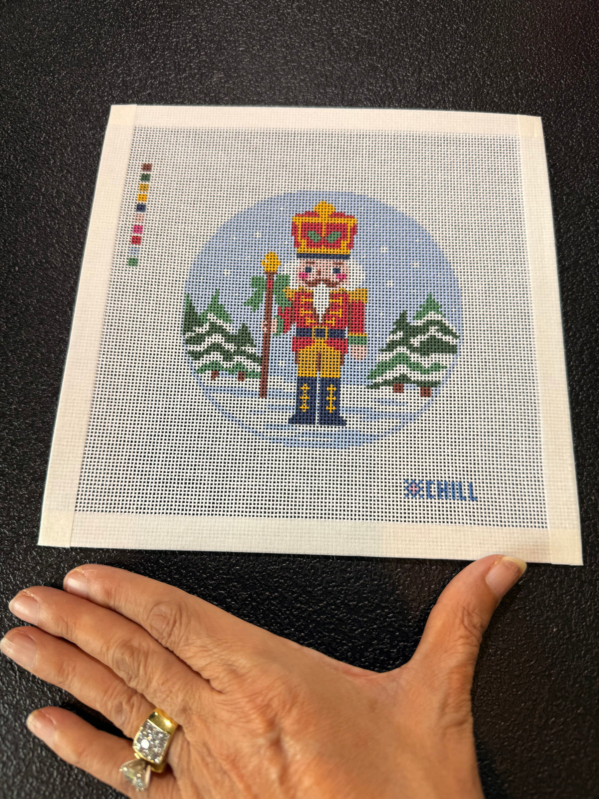 Snow-covered evergreen trees detail on Christmas needlepoint canvas
